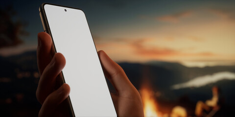 CU Caucasian male using his phone near campsite in the evening, screen mockup