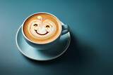 Fototapeta Most - The most happiest and motivation day of the year. Copy space, empty place for text. Happy creamy coffee with smiling face in big yellow cup on blue background.
