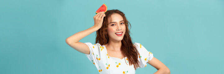 Wall Mural - Beautiful young woman with slices of fresh watermelon on color background