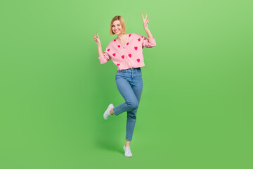 Sticker - Full body photo of pretty young girl showing double v-sign hi wear trendy pink strawberry print outfit isolated on green color background