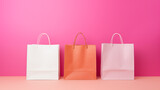 Fototapeta Dinusie - Paper Shopping Bags on a pink background.