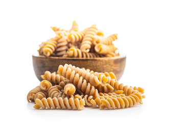 Wall Mural - Raw whole grain fusilli pasta. Uncooked pasta isolated on white background.