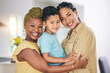 © Charlize D/peopleimages.com - LGBT, child hug or portrait of happy family, non binary mama or transgender mom bonding, smile and care for young son. Lesbian love, home and face of gay people, mothers or women embrace adoption kid
