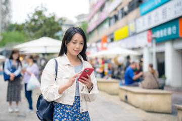 Sticker - Woman use of mobile phone in city