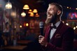Male stand-up comedian talking in cafe and having stand up comedy show