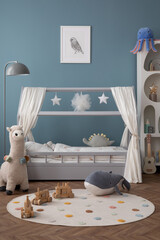 Wall Mural - Creative composition of child room interior with mock up poster frame, cozy bed, stylish rack, blue wall, rack with toys, plush lama, gray lamp, guitar and personal accessories. Home decor. Template.