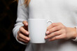 Commercial, industry, fashion and style, drinks and beverages concept. Woman hands holding white blank with copy space mug or cup of coffee or tea