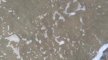 Close-up Of Sea Wave At The Sandy Beach With Strong Current