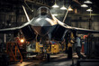 Aviation engineer performing maintenance on a modern jet fighter inside a military hangar.