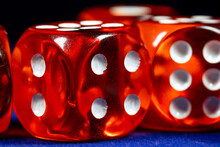 Red Dice Close-up On A Blue Casino Table