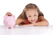 © Shrikant/peopleimages.com - Piggy bank, savings and portrait of girl child with money on isolated, transparent or png background. Cash, box and face of kid with budget, investment and coin container for future financial freedom