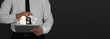 © New Africa - Marketing strategy. Man using tablet computer on black background, banner design with space for text. Different icons flying out of device screen