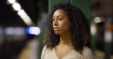 Poster - Young black woman serious sad face at subway platform