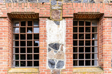 Old building, broken windows, brick.