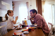 © Geber86 - Happy little girl having breakfast with her father in the kitchen