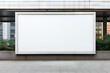 © vejaa - Blank white horizontal billboard in the street. Mockup advertising board, digital display, showcase with urban background