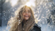 Winter walk. A young woman in winter clothes walks through a snowy forest, having fun with the snow on a beautiful frosty day. Concept of weekend, fun.