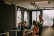 © qunica.com - Beautiful hairdresser brushing her clients hair and talking to her while standing at the hair salon