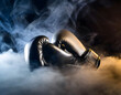Boxing gloves in smoke