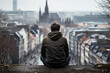 Lonely adult male in gritty cityscape background with empty space for text 