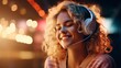 Young smiling woman in headphones listening to music, positive emotions
