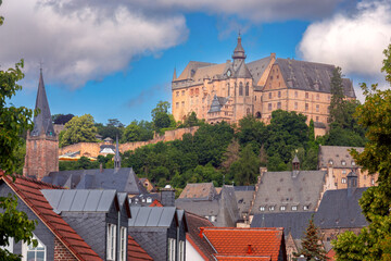 Wall Mural - View of the castle on the mountain in the city of Marburg on a sunny summer morning.