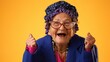 © Robert Peak - Closeup of shocked, surprised, funny toothless crazy grandmother mature woman, 80s, acting isolated on yellow background. Concept of elderly winner.
