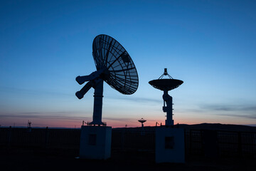 Wall Mural - The silhouette of a radio telescope