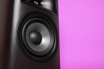 Wall Mural - One wooden sound speaker on violet background, closeup. Space for text