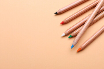 Poster - Colorful pastel pencils on beige background, space for text. Drawing supplies