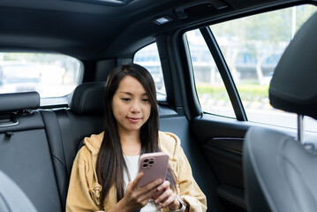 Canvas Print - Woman use of mobile phone in car