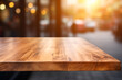 Top of surface wooden table with blurred city buildings  background.
