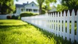 White picket fence in a lush green grassy area in the foreground of a residential home, AI-generated