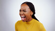 © Wesley JvR/peopleimages.com - Angry, scream and frustrated face of black woman shout and yelling in studio white background. Crisis, stress and person voice anger, rage or crazy emoji with problem, mistake or annoyed with fail