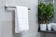 Towel neatly hanging on a modern chrome holder. Generative AI