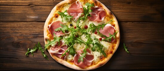 Sticker - Top view of a rustic wooden table background showcasing a hot pizza topped with mozzarella cheese ham pesto sauce and fresh arugula