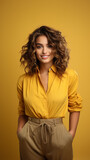 Fototapeta  - Girl with stylish haircut, looking at camera with smile. Vertical photo for smartphone. Portrait of joyful lady in summer outfit. Yellow background. High quality photo.