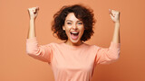 Fototapeta  - 
Photo of cheerful overjoyed funny woman raise fists in victory see big bargains in phone isolated on beige color background
