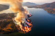 Aerial View of a Devastating Wildfire Engulfing a Forested Peninsula on a Serene Lake