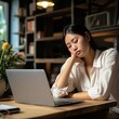 © Yulia - Exhausted Asian woman sits overworked needs rest fatigue taking nap near laptop. Tired Chinese girl student or freelancer fell asleep on table while long time works remotely or online studying at home