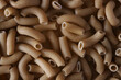 Close up image of brown lentil fusilli pasta. Top view.