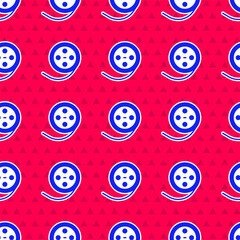 Wall Mural - Blue Film reel icon isolated seamless pattern on red background. Vector