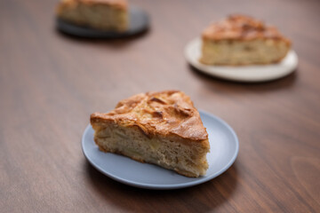 Wall Mural - Portions of of charlotte apple pie on a saucers on walnut table