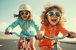 © Iryna - Happy children, two girls, ride bicycles and wear helmets for safety reasons. They are having fun and enjoying a day of relaxation and outdoor exercise.
