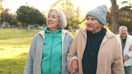 Wall Mural - Senior couple, walking and talking in park together for morning exercise, bonding and happy conversation. Smile, nature and old people, men and women in garden with discussion and sunshine in trees.