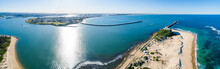 Aerial Panorama Of Newcastle Harbour On Sunlit Day Where The River Meets The Sea