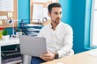 © Krakenimages.com - Young hispanic man business worker using laptop working at office
