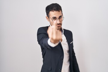 Poster - Handsome business hispanic man standing over white background showing middle finger, impolite and rude fuck off expression