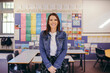 © Austockphoto - Confident Aboriginal female primary school teacher in her classroom