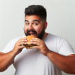 © Igor - Overweight man eat burger on solid background. ai generative